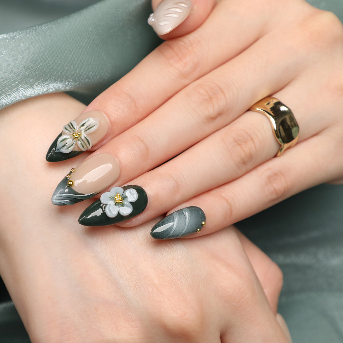 close up look of green almond nails acrylic nail set