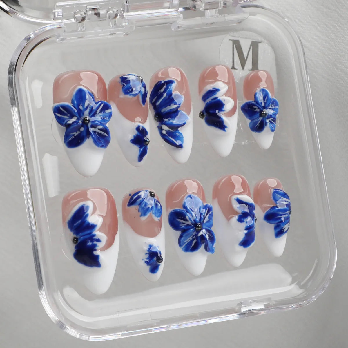 Handmade floral almond acrylic press-on nails inspired by porcelain