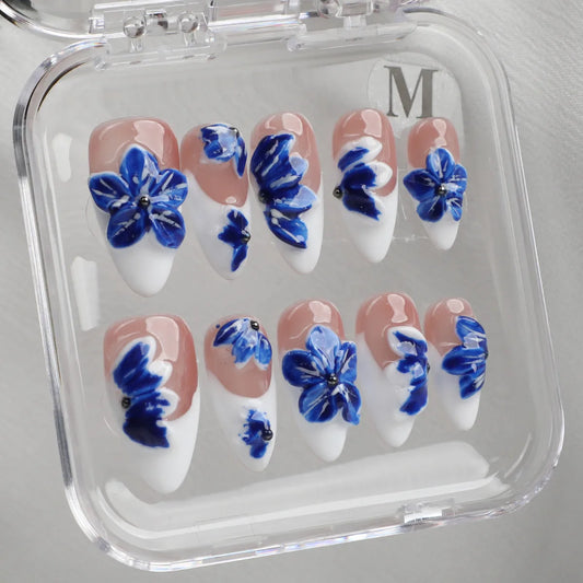 Handmade floral almond acrylic press-on nails inspired by porcelain