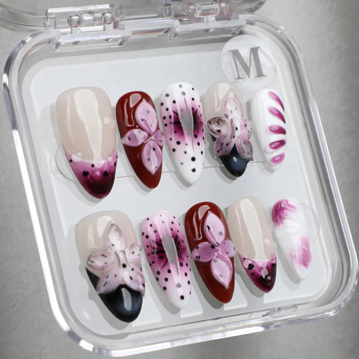Pinkish purple floral style almond handmade acrylic press-on nails in transparent box in size M.